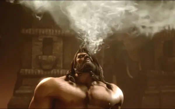 HD PC desktop wallpaper of Arjun from Street Fighter 6 — a muscular, shirtless man looking up as a plume of smoke rises around him against a dark temple backdrop.