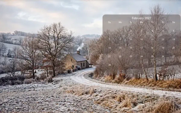 February 2027 calendar on a 5K Ultra HD PC desktop wallpaper: frost-covered road winding past bare trees to a stone house in a quiet winter landscape.