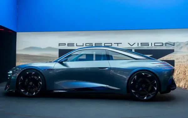Peugeot RCZ Vision electric concept car in side profile, featured in a 2K Quad HD PC desktop wallpaper and background.