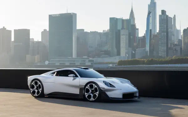 White Porsche Mission S luxury sports car against a city skyline, 5K Ultra HD desktop wallpaper and background.