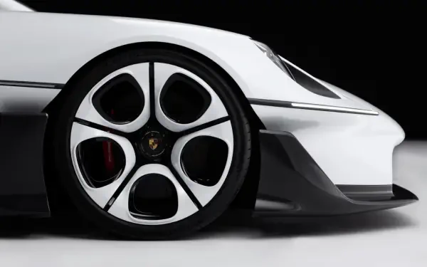 Close-up of a Porsche Mission S sports car wheel against a white body, featured in an HD PC desktop wallpaper and background.