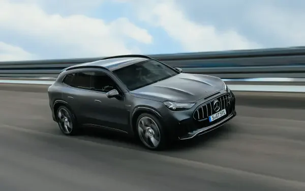 Gray Mercedes-AMG GT SUV driving on a highway, 2K Quad HD PC desktop wallpaper and background.
