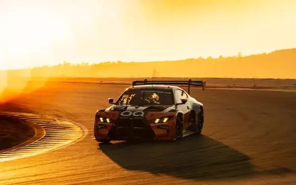 BMW M4 GT3 race car speeding around a sunlit track, HD desktop wallpaper and background