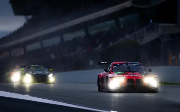 BMW M4 GT3 race cars speeding through a rainy FIA World Endurance Championship night race, HD desktop wallpaper