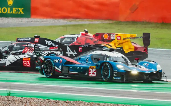 Alpine A424 race car battling on track in an auto racing scene, featured in a 5K Ultra HD PC desktop wallpaper.