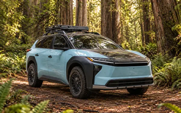 Toyota bZ Woodland Concept electric SUV parked in a forest, 2K Quad HD desktop wallpaper and background.