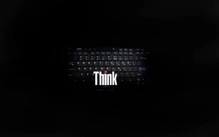 A sleek HD desktop wallpaper featuring a Lenovo keyboard illuminated against a dark background, emphasizing the Think branding in a modern design.