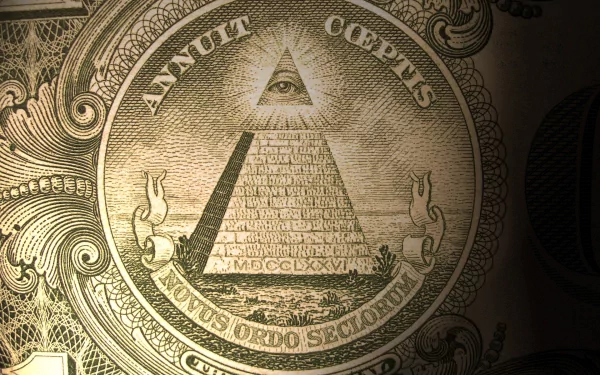 Close-up HD desktop wallpaper of the all-seeing eye pyramid from US currency, showcasing detailed engraving and symbolic man-made money design.