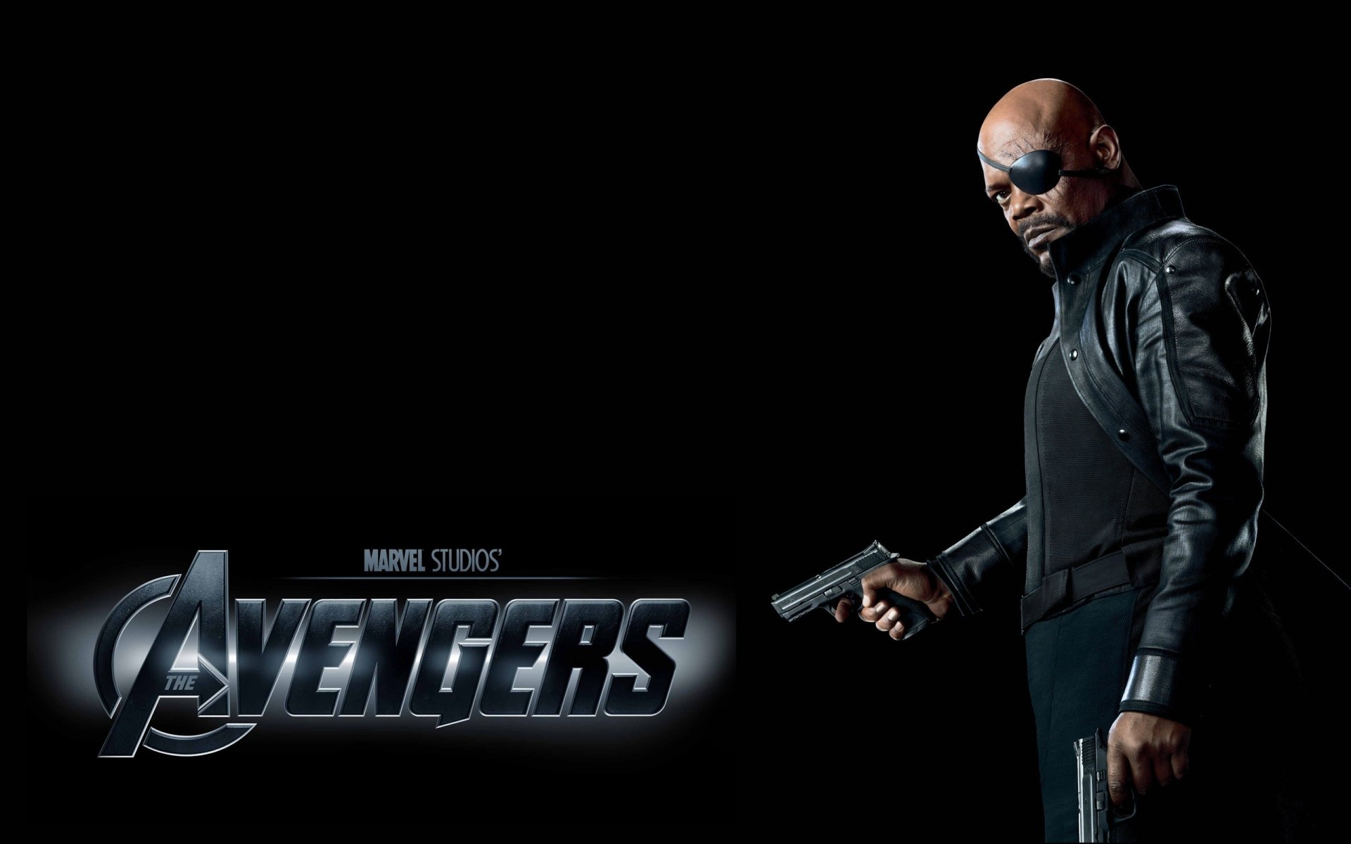 HD PC desktop wallpaper featuring Samuel L. Jackson as Nick Fury from Marvel Studios' Avengers, holding a gun against a black background.