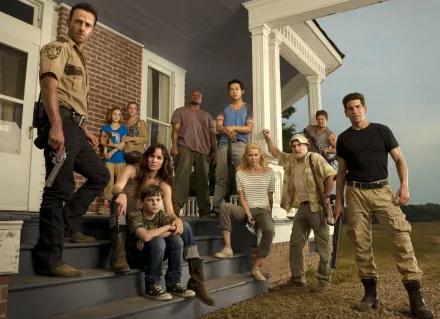 HD desktop wallpaper of The Walking Dead TV show cast, featuring characters assembled on the steps of a farmhouse, exuding a sense of determination and unity.