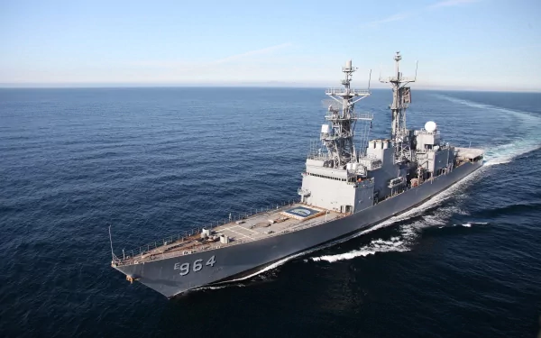 4K Ultra HD image of a military ship sailing in open sea with a clear sky background, showcasing sleek design and naval power.