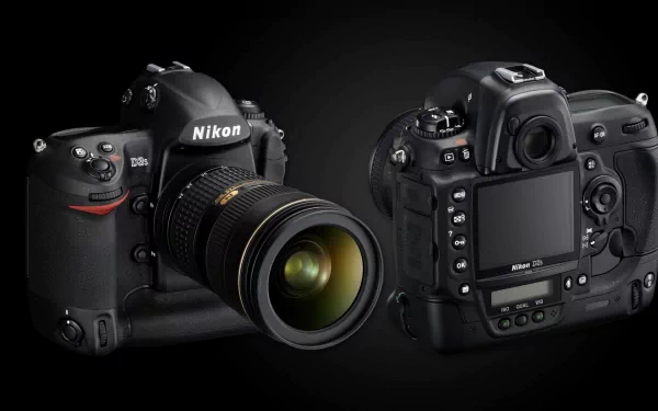 A sleek Nikon D3S camera showcased from the front and back, featuring a lens, set against a dark background, creating an eye-catching HD desktop wallpaper.