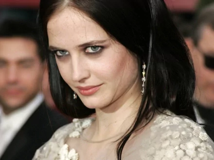 HD PC desktop wallpaper featuring a close-up portrait of celebrity Eva Green with dark hair and striking eyes at a formal event.