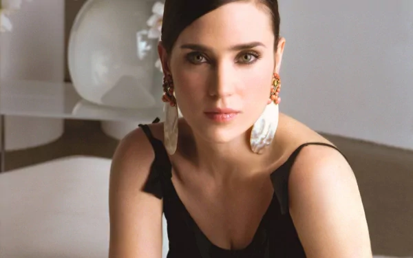 A stunning HD wallpaper featuring celebrity Jennifer Connelly, showcasing her elegant style and captivating gaze, set against a modern, minimalist background.