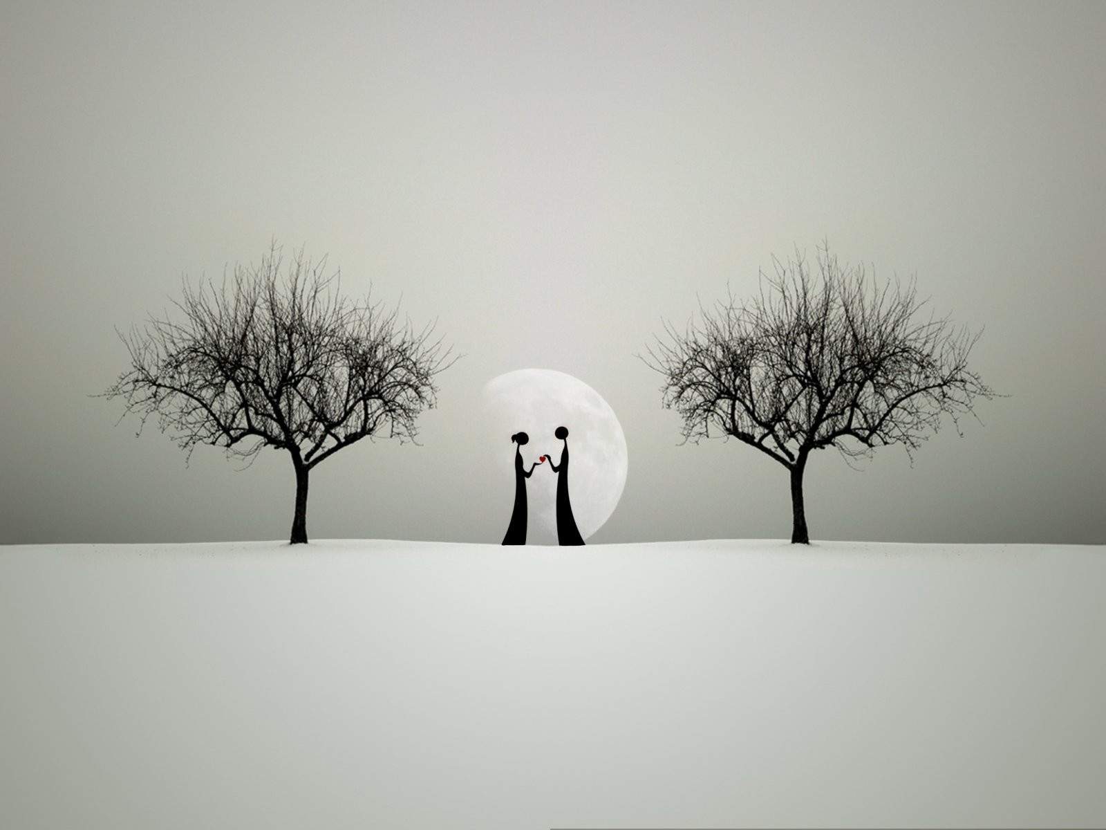 A romantic silhouette of a couple holding hands beneath a large moon, framed by two barren trees, creates an artistic atmosphere of love in this HD desktop wallpaper.