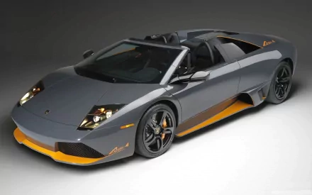 HD PC desktop wallpaper featuring a sleek Lamborghini Murcielago LP 650-4 Roadster in gray with orange accents, showcasing luxury and high-performance automotive design.