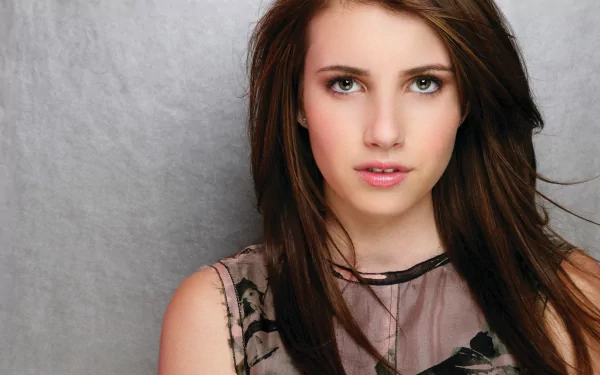 Emma Roberts poses in a close-up portrait, showcasing her expressive eyes and smooth skin. This 4K Ultra HD image serves as a stunning PC desktop wallpaper and background.