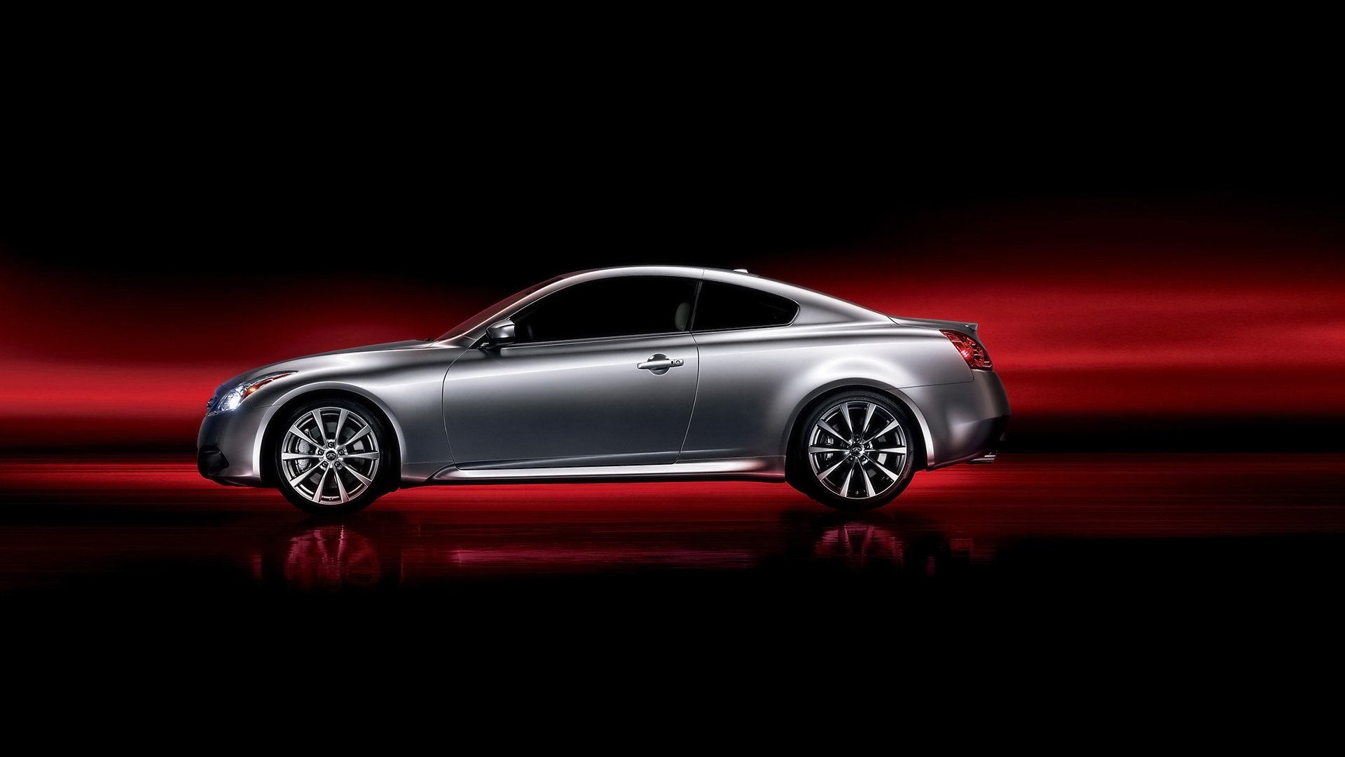 Silver Infiniti coupe in side profile on a red-black gradient, HD PC desktop wallpaper background.