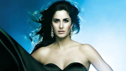HD desktop wallpaper of Indian actress and celebrity Katrina Kaif, showcasing her in a glamorous pose with a blue background.