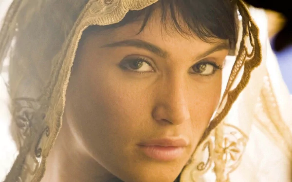 A captivating HD desktop wallpaper featuring Gemma Arterton, showcasing her striking features and enigmatic expression, set against a softly lit background.