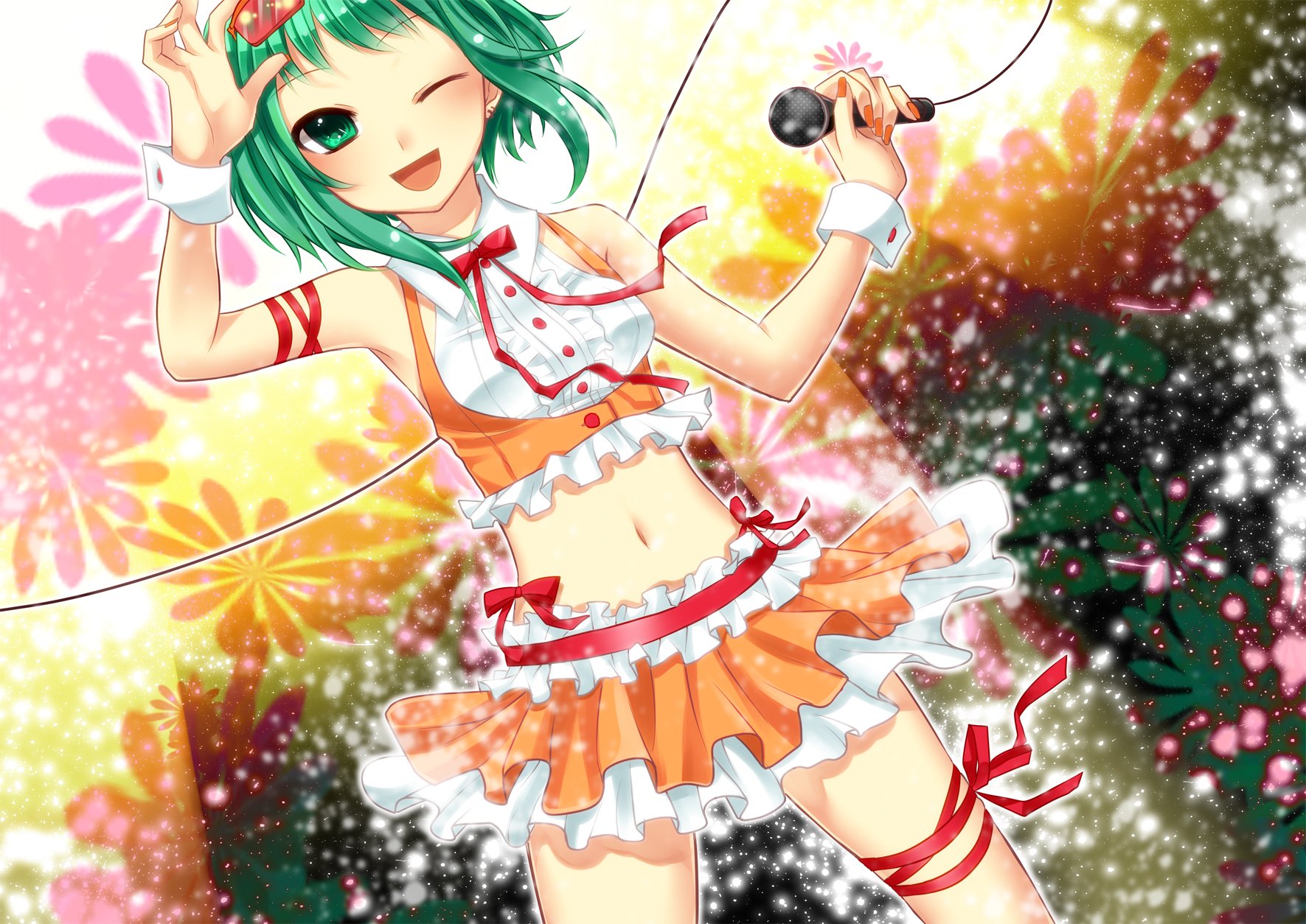 Anime-style Vocaloid character with green hair and a vibrant orange outfit sings energetically, set against a colorful, sparkling background in this HD PC desktop wallpaper.