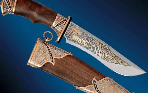 A beautifully crafted knife with intricate gold detailing on the blade and handle, resting in an ornate wooden sheath, set against a deep blue background. HD PC desktop wallpaper.