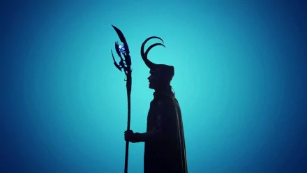 A striking silhouette of Loki from Marvel Comics, holding his iconic staff against a vibrant blue background. This HD wallpaper captures the essence of the character from the Avengers movies.