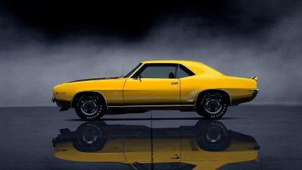 HD PC desktop wallpaper and background of a yellow Chevrolet classic muscle car in profile, reflected on a glossy floor against a moody dark backdrop.