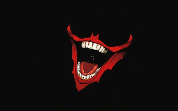 A striking HD PC desktop wallpaper featuring a bold, exaggerated Joker face against a dark background, showcasing sharp teeth and a menacing grin.