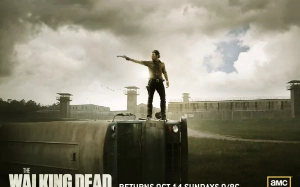 Rick Grimes, played by Andrew Lincoln, standing atop a bus with a gun in a prison setting from the TV show The Walking Dead. The background is dark and ominous, with cloudy skies.