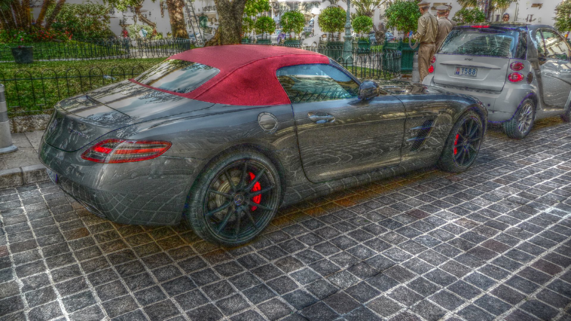 HD desktop wallpaper featuring a dreamlike HDR image of a sleek Mercedes car parked on a cobblestone street in Monaco, showcasing luxury and style.