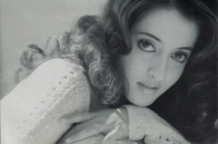 Black and white HD PC desktop wallpaper featuring a close-up portrait of woman Raima Sen with soft curls and expressive eyes.