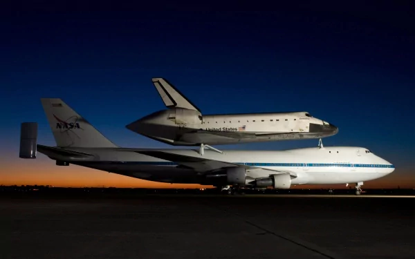 The image showcases NASA's Space Shuttle Endeavour mounted on a Boeing 747, set against a stunning twilight sky, creating a striking desktop wallpaper for space enthusiasts.