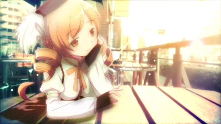 HD PC desktop wallpaper featuring Mami Tomoe from the anime Puella Magi Madoka Magica, depicted sitting thoughtfully at an outdoor table with a warm, glowing background.