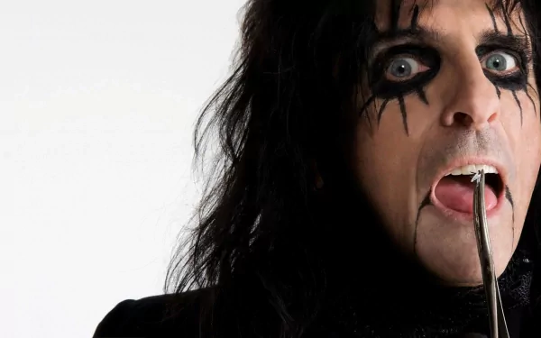 HD PC desktop wallpaper featuring a close-up of Alice Cooper with dark theatrical makeup and a dramatic expression, highlighting his iconic rock music persona.