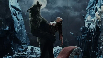 A scene from the movie Van Helsing featuring Anna Valerious being held by a werewolf under a full moon, set in a dark, eerie environment. HD desktop wallpaper and background.