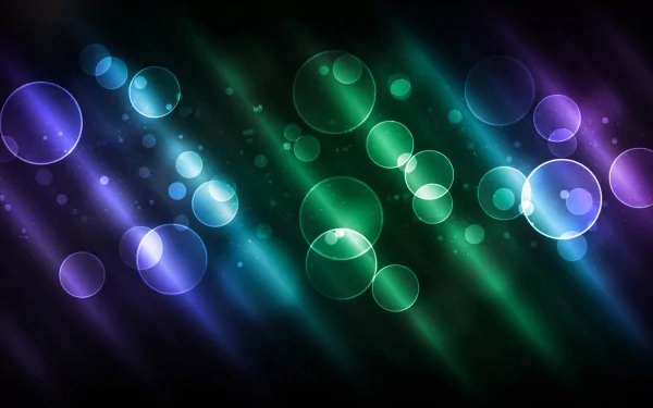 HD PC desktop wallpaper featuring an abstract design of glowing circles in blue, green, and purple hues with diagonal light streaks on a dark background.