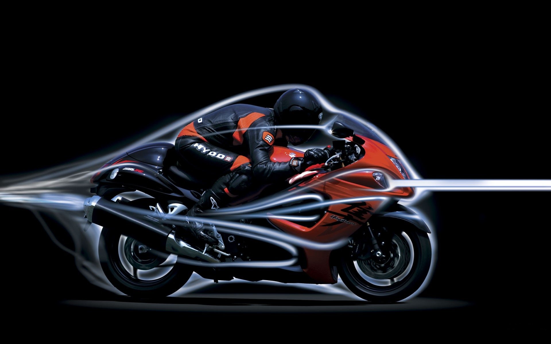 HD PC desktop wallpaper of a red sport motorcycle and rider with dynamic motion trails on a black background — bike, vehicle, motorcycle.