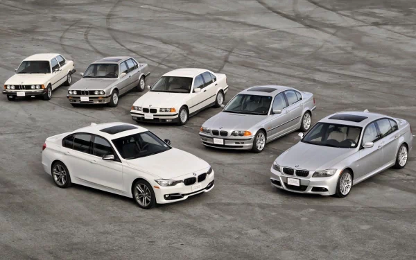 A striking HD desktop wallpaper featuring a collection of BMW vehicles from various generations, showcasing their distinct designs and evolution in a dynamic arrangement.