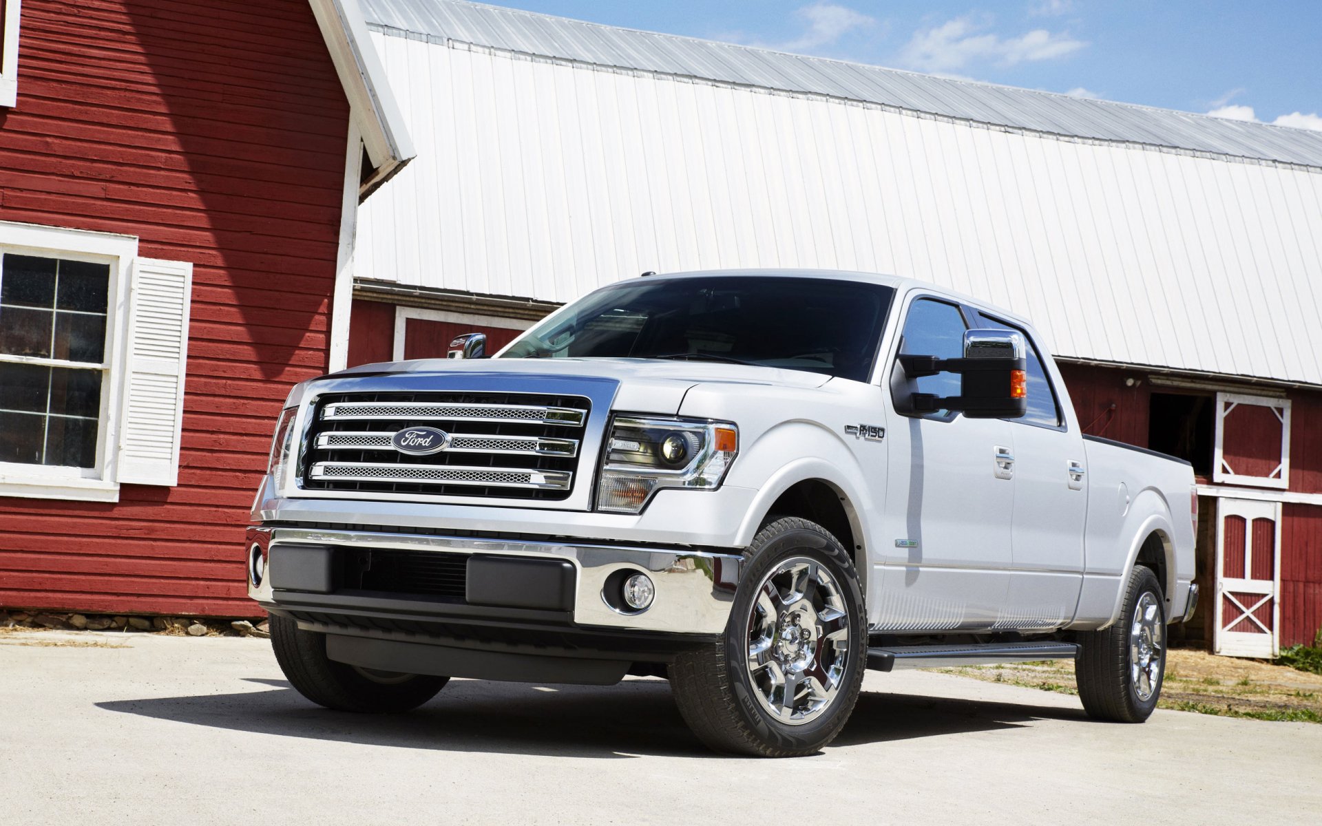 White Ford F-150 parked in front of a red barn, high-resolution 2K Quad HD PC desktop wallpaper and background.