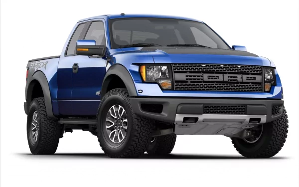 HD desktop wallpaper featuring a blue Ford Raptor truck with rugged tires, showcasing the vehicle's bold and powerful design.