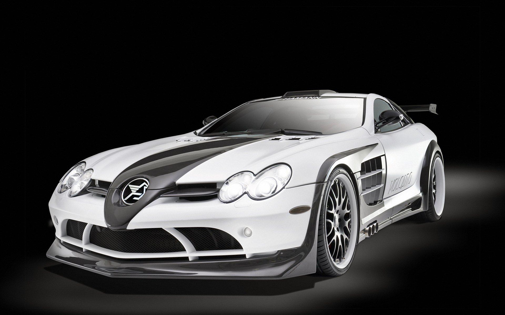 HD desktop wallpaper featuring a sleek silver Mercedes sports car against a black background, highlighting its aerodynamic design and detailed features.