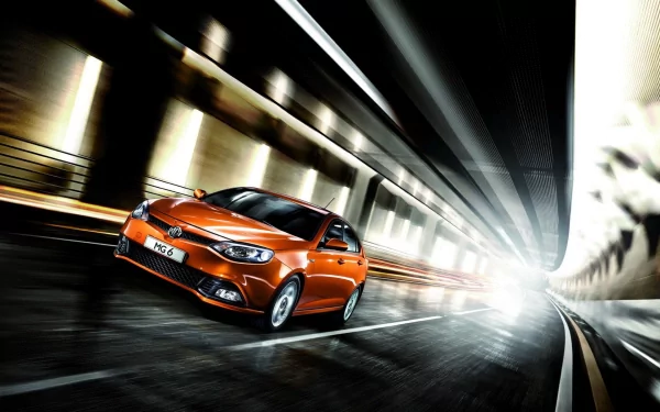 HD PC desktop wallpaper featuring an orange SAIC MG vehicle speeding through a modern, illuminated tunnel with dynamic motion blur effects.