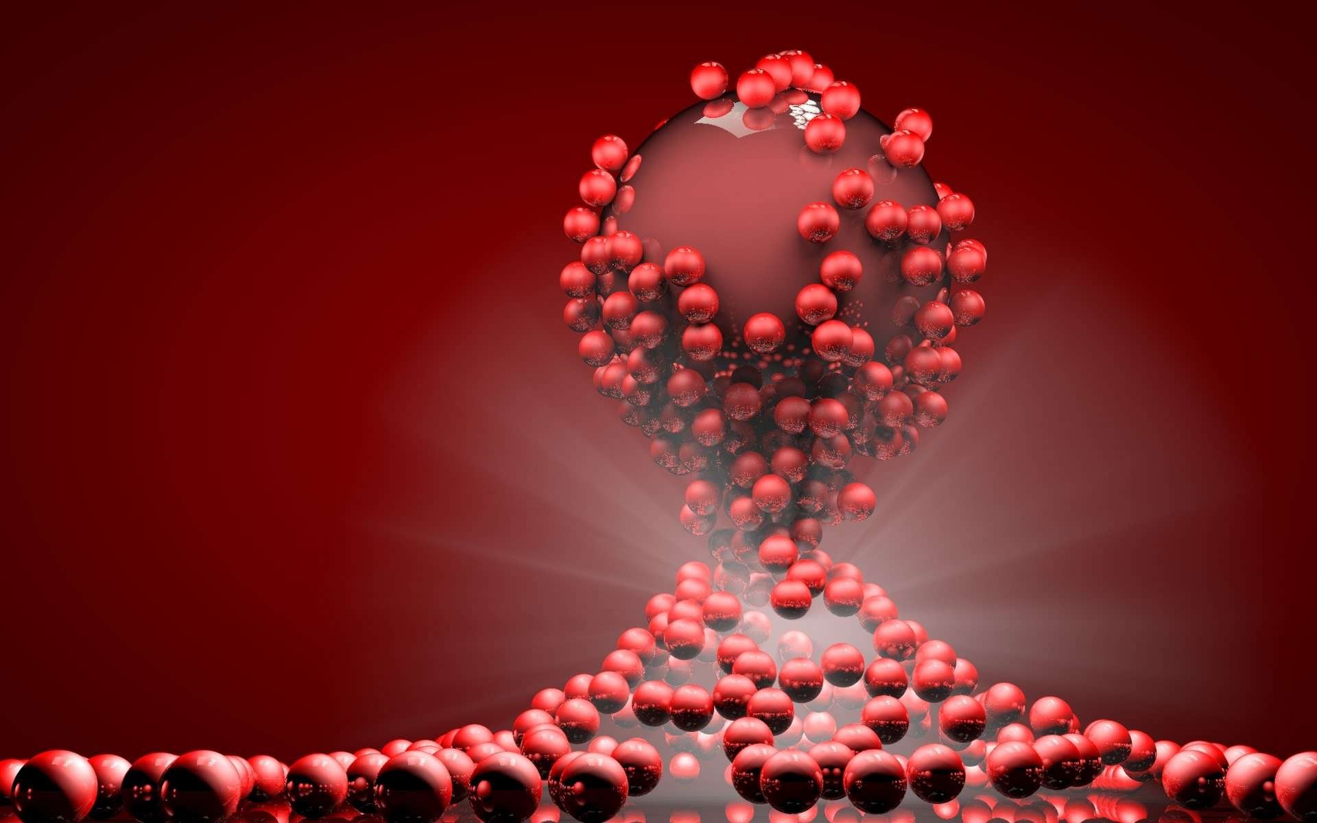 CGI 3D abstract HD desktop wallpaper featuring a large central sphere surrounded by smaller red spheres on a reflective red surface with radiant light effects.