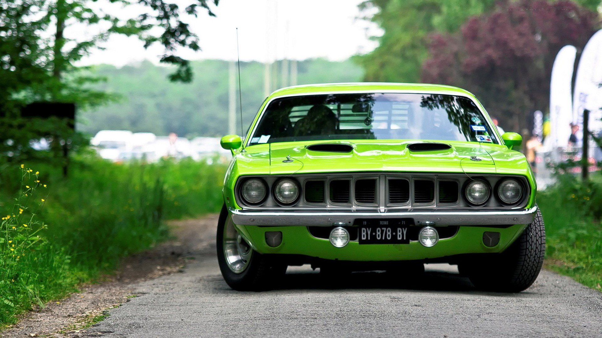 Bright green Plymouth Barracuda parked on a rural road, captured in high-definition as a PC desktop wallpaper and background.