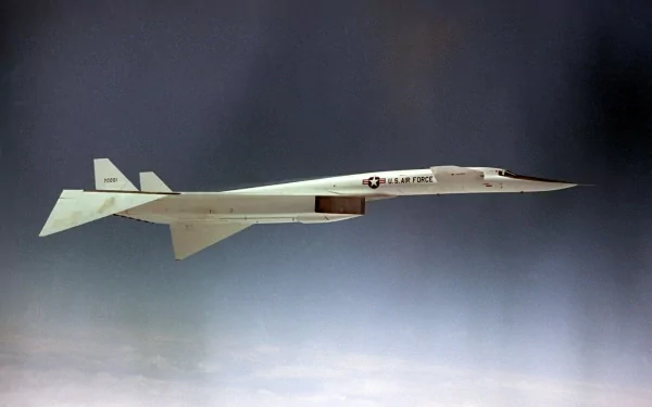 HD desktop wallpaper showing a North American XB-70 Valkyrie military supersonic prototype flying above clouds, long slender fuselage and twin vertical tails.