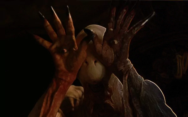 HD PC desktop wallpaper featuring a dark, eerie scene from the movie Pan's Labyrinth, highlighting the Pale Man with his distinctive eye-covered hands.