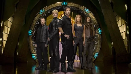 A stunning HD wallpaper featuring characters from Stargate Atlantis, including Teyla Emmagan, Ronon Dex, John Sheppard, Rodney McKay, and Samantha Carter, set against the iconic Stargate backdrop.