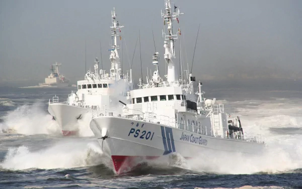 A dynamic HD wallpaper featuring Japanese coast guard boats racing through turbulent waters, showcasing military prowess and maritime strength.