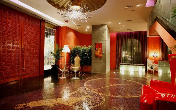 4K Ultra HD desktop wallpaper showing a luxurious man-made interior with elegant red walls, ornamental ceiling, chandelier, and polished floor in a stylish room.